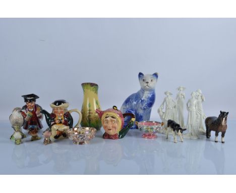 A collection of English ceramics, including Beswick Birds and Animals, a large Arthur Wood blue and white cat, four Royal Wor