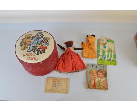 A Chad Valley Sutty hand puppet, a Chad Valley reversible doll, two children's books, a cigarette card album. Together with a
