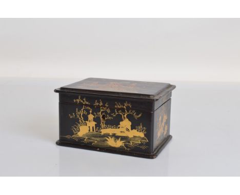 A lacquered papier mache tea caddy, with original metal lining and inner lid. 16.5cm x 12cm x 9cm tall.