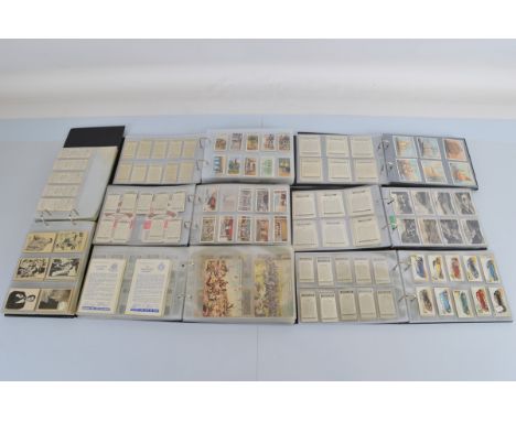 Seven albums containing assorted bubble-gum, cigarette and tea cards, including Bat Laffs, A&amp;BC Man From Uncle, The Saint