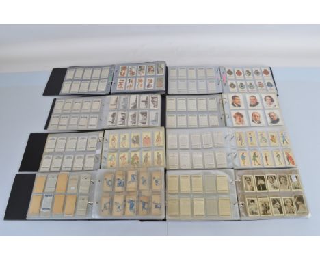 Eight albums containing assorted bubble-gum, cigarette and tea cards, including Wills, De Reszke, Carreras, Turf, Morris &amp