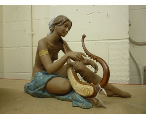 A LLADRO FIGURE PLAYING HARP, 'Strings of the Heart' No.2438