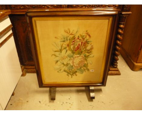 A VICTORIAN ROSEWOOD FIRESCREEN, with needlework inset panel