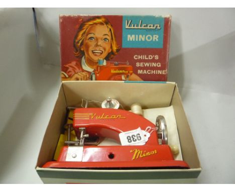 A BOXED CHILTERN 'VULCAN MINOR' CHILD'S SEWING MACHINE, complete with instructions, box complete with packing pieces