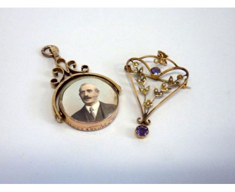 TWO ITEMS OF JEWELLERY, to include an Edwardian amethyst and pearl openwork pendant together with a 10ct gold Edwardian swive