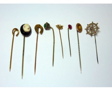 A COLLECTION OF STICKPINS, to include a jet cameo stickpin, a pearl stickpin together with six others (8)