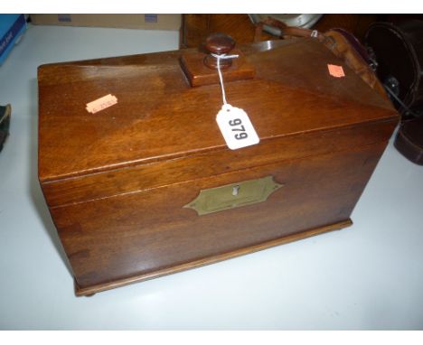 A MID VICTORIAN MAHOGANY TEA CADDY, of sarcophagus form, with later turned finial, enclosing twin division interior with one 