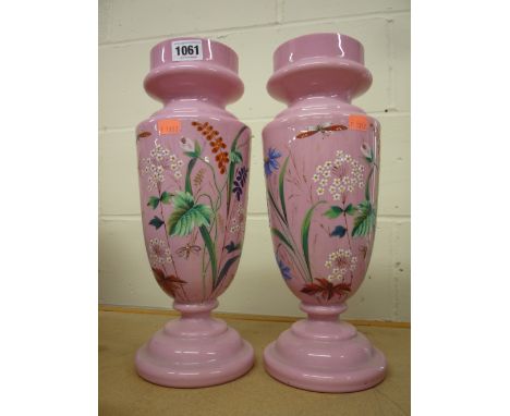 A PAIR OF PINK OPAQUE GLASS VASES/OIL LAMP BASES, decorated with insects and foliage (2)
