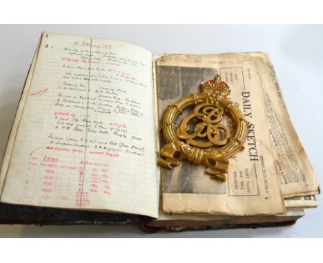 A LARGE HARDBOUND LEDGER, (water damaged), for February 1917 onwards showing several entries for equipment supplied to the Mi