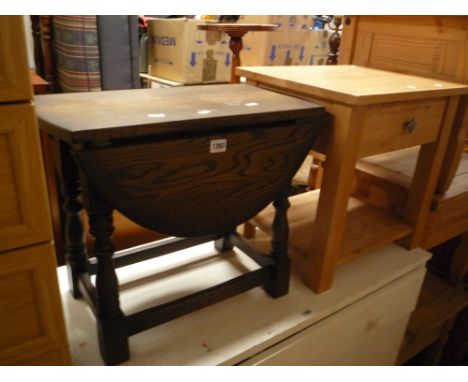 A SMALL OAK DROP LEAF TABLE, and a light oak occasional table with a single drawer (2)