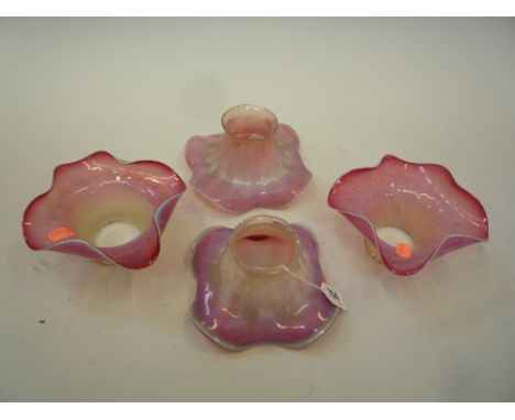 FOUR RUBY/OPAQUE COLOURED GLASS FLOWER HEAD SHAPED SHADES, (4)