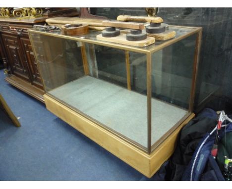 A LIGHT OAK AND BRASS FRAMED GLAZED HABERDASHERY/SHOP DISPLAY COUNTER