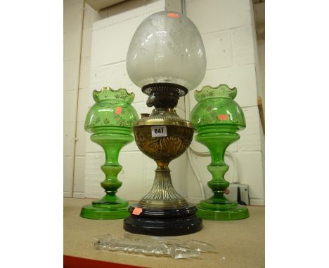 A BRASS OIL LAMP WITH GLASS SHADE, and a pair of green lustres, missing droppers (3)