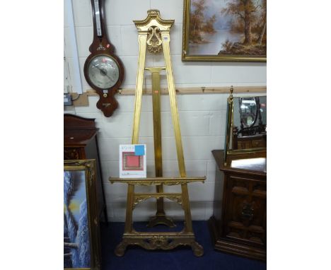 AN ENGLISH EASEL, gilded with carved sections (provenance, purchased from Bonhams March 1991, catalogue present) (s.d.)