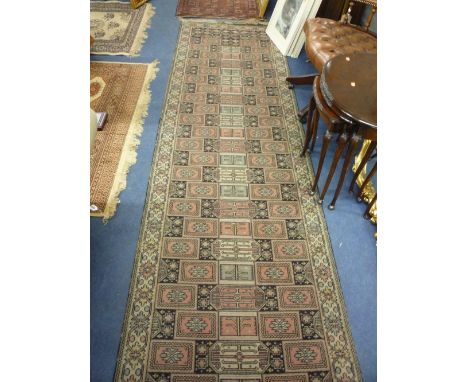 A CARPET RUNNER, approximate size 365cm x 90cm