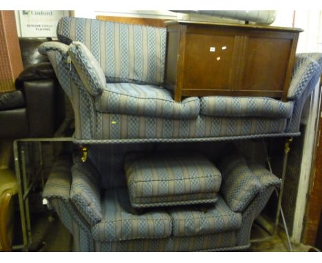AN UPHOLSTERED THREE PIECE SUITE, comprising of two two seater settees and a pouffe (3)