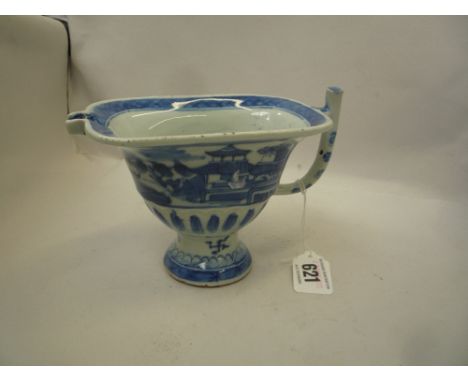 A CHINESE BLUE AND WHITE SAUCE BOAT, Qianlong of helmet shape and painted with a riverscape with pagodas, 11cm high