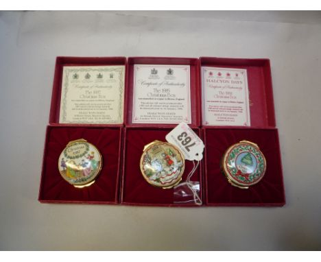 THREE BOXED HALCYON DAYS ENAMEL CHRISTMAS BOXES, 1985, 87 and 88