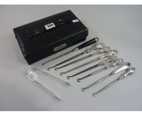 A COLLECTION OF SILVER HANDLED BUTTON HOOKS, and a pair of Bateman sugar nips (parcel)