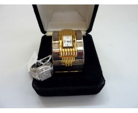 TWO ITEMS, a bangle style watch together with a gents ring