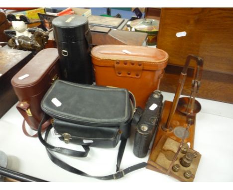 A MINOLTA X300 35MM SLR CAMERA, a Tamron F80 lens, a Kodak camera, two pairs of binoculars and a set of scales and weights (6
