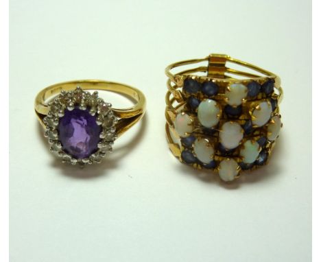 TWO RINGS, the first an 18ct gold amethyst and diamond cluster ring with oval shape amethyst within a surround of brilliant c