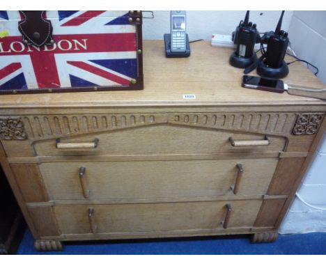 A LIGHT OAK CHEST, of three long drawers