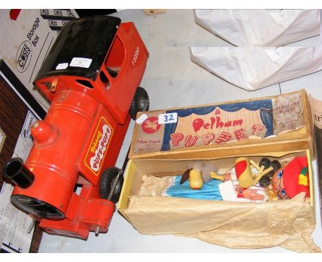 An old Tri-ang tinplate loco, together with a boxed Pelham Puppet 