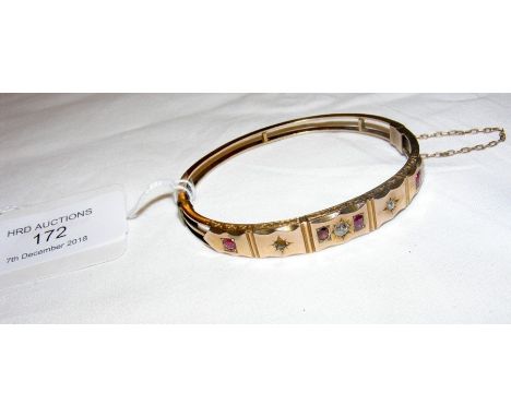 A ruby and diamond bangle in gold setting 