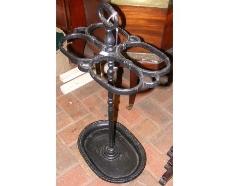 A cast metal stick/umbrella stand 