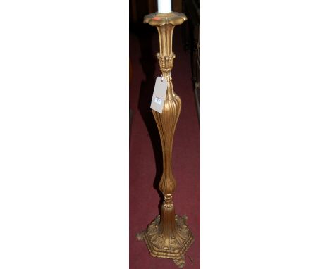An early 20th century floral carved giltwood standard lamp 