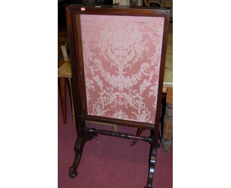 A 19th century mahogany floral silk inset fire screen, having two adjustable inset panels 