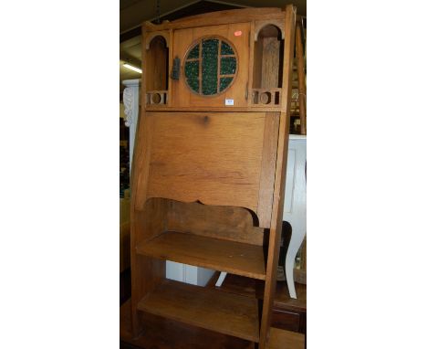 An Arts & Crafts light oak combination student's bureau