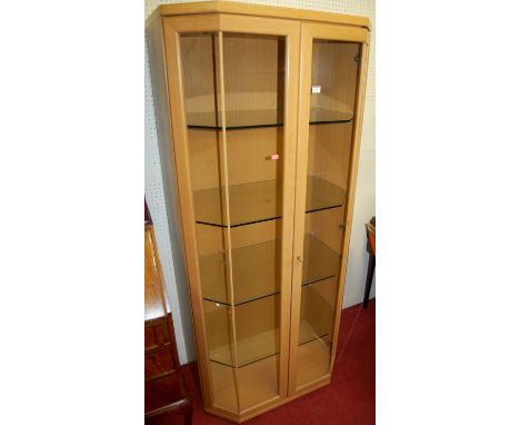 A contemporary light oak double door glazed display cabinet (one glazing panel A/F)