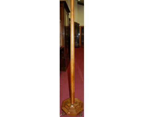 An Art Deco figured walnut octagonal standard lamp