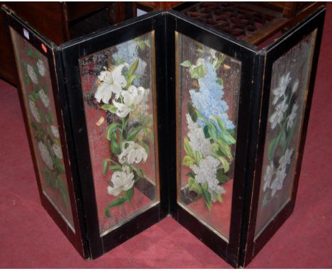 An early 20th century ebonised and floral painted mirror insert four section fire screen