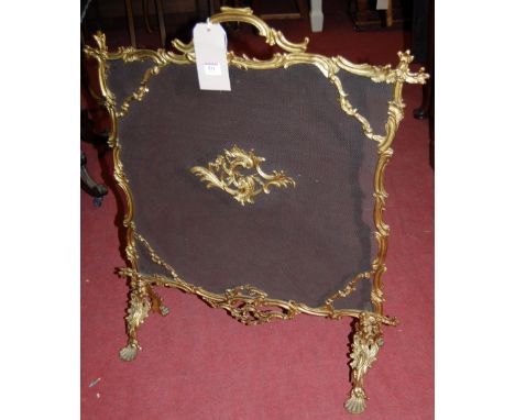 A circa 1900 French gilt metal and mesh inset fire screen in the Rococo style