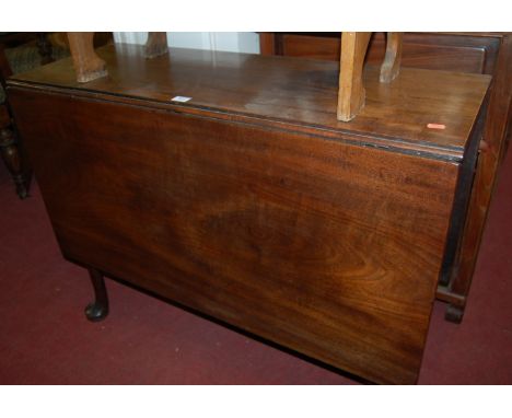 A mid 18th century mahogany drop leaf dining table with gate leg action