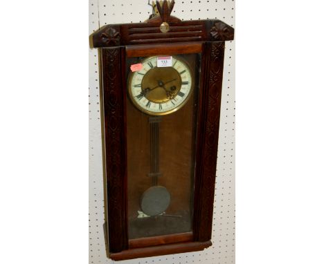 An early 20th century beech drop trunk wall clock