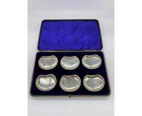 A boxed set of silver butter dishes, hallmarked.
