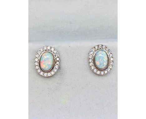 A pair of silver cz and opal panelled stud earrings 