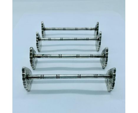 A selection of four silver knife rests marked H800s 