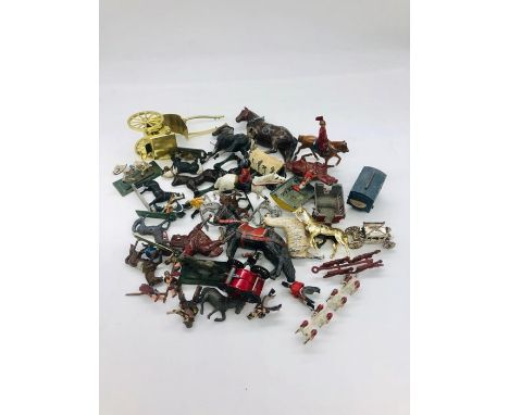 A selection of diecast model soldiers on horseback and horse carriages AF
