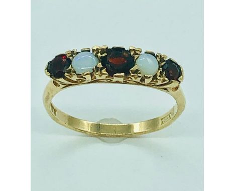 A 9ct gold ruby and opal ring 