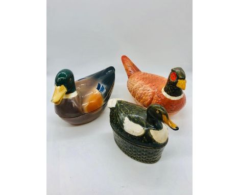 Three lidded ceramic egg holders in the form of ducks and pheasants 