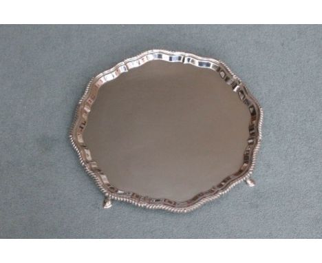 A Silver tray, hallmarked London 1968 on four feet by Henry Pidduck &amp; Sons (1159g)