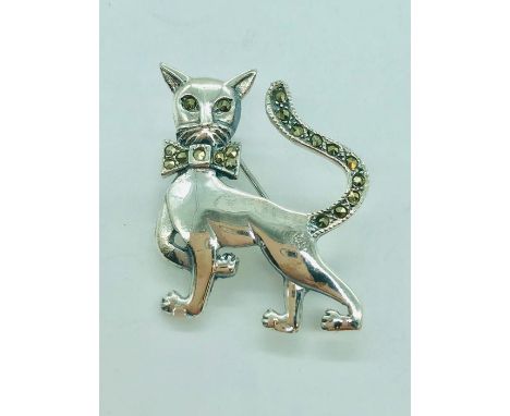 A silver brooch in the form of a cat with marcasites