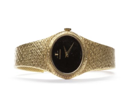 LADY'S JAEGER LE COULTRE EIGHTEEN CARAT GOLD MANUAL WIND WRIST WATCH
the black oval dial lacking numerals, with tapered gold 
