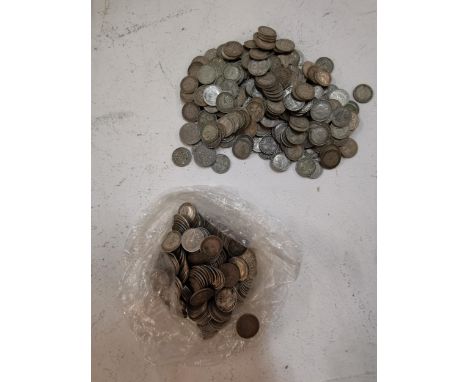 A large collection of pre-1920s silver threepence pieces to include an 1887 example, 410g, together with a collection of post