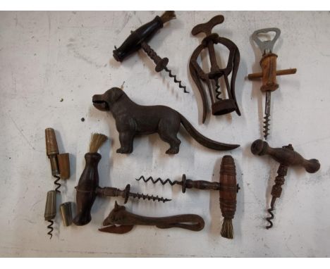 Eight vintage corkscrews together with a cast iron nut cracker in the form of a dog, Location RWF 